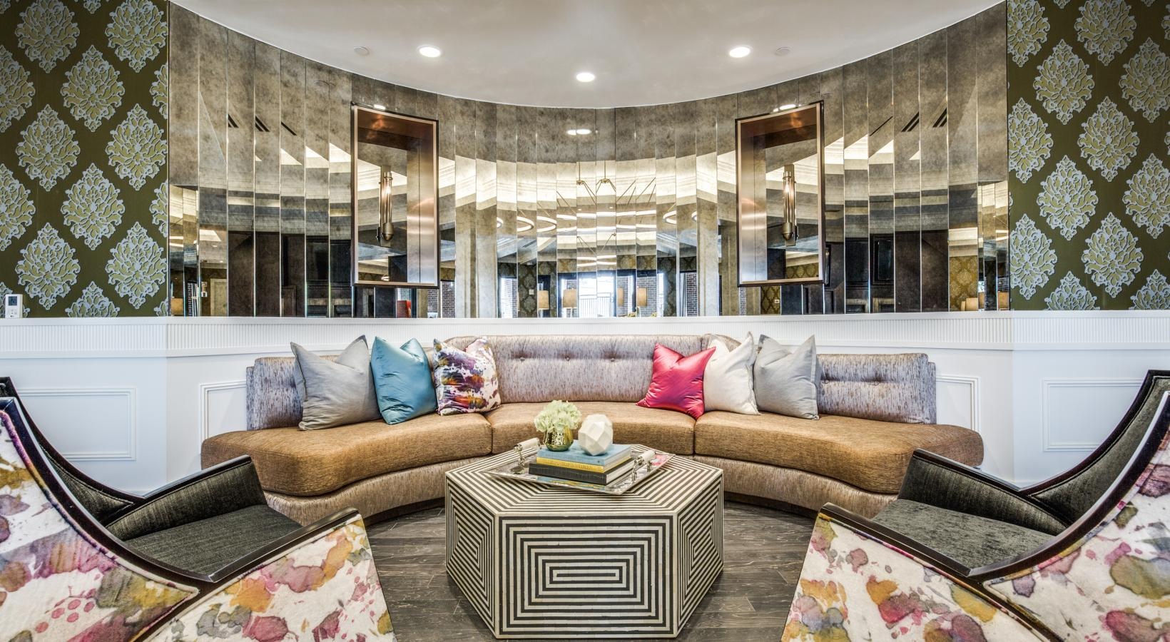 Access to resident-only features a large room with a large glass wall and a couch