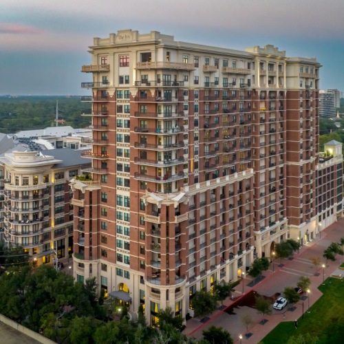 The essence of exceptional living a large building with many windows