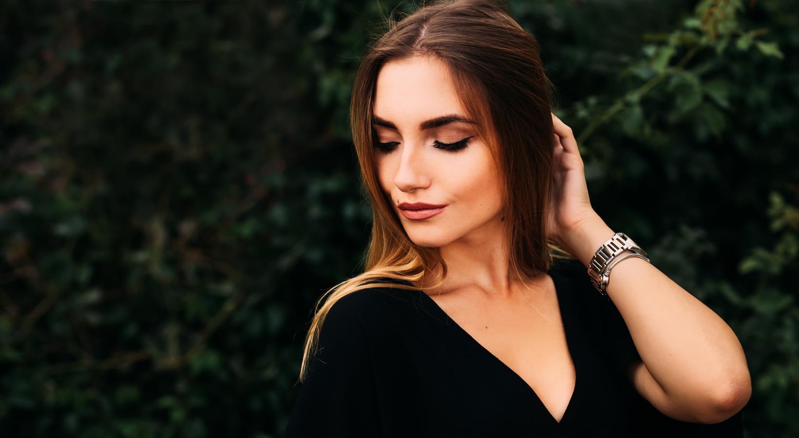 The essence of exceptional living a woman with her hand on her head