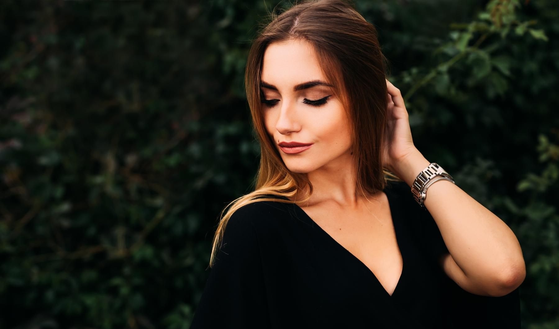 The essence of exceptional living a woman with her hand on her head