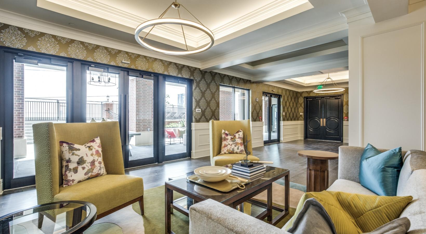 Enjoy our resident-only features a living room with large chairs and many windows