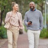 a man and a woman walking outside