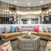 a spacious clubroom with a large mirror