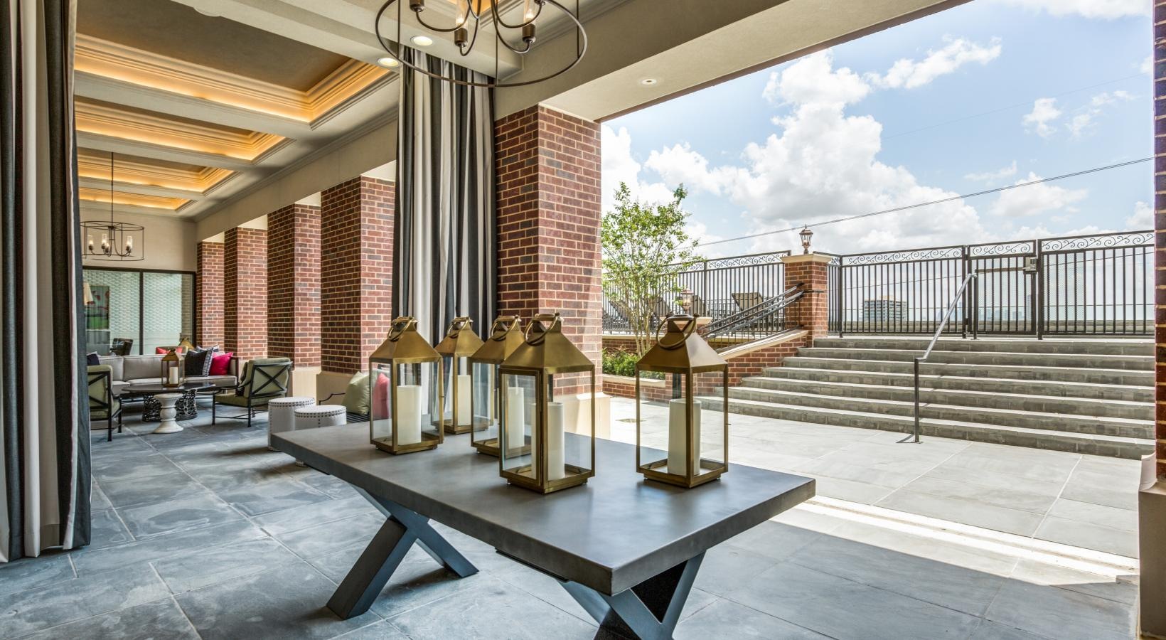 Take advantage of all The Ivy has to offer a table and chairs in an outdoor room