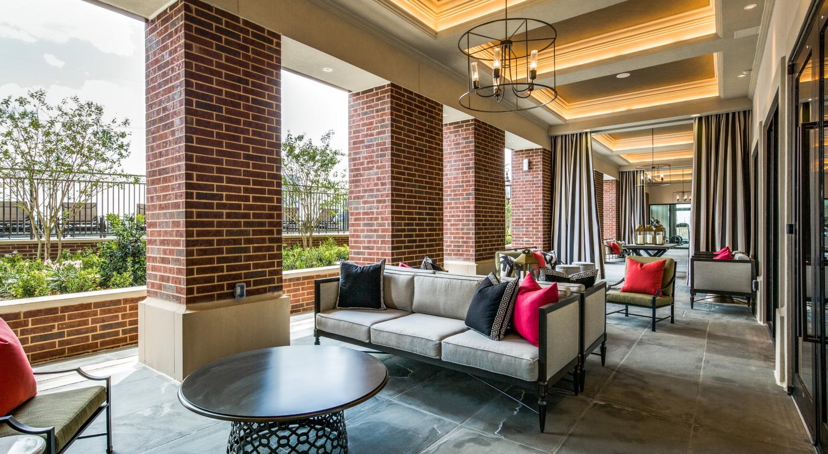 Everything within reach an outdoor walkway with a couch and a table