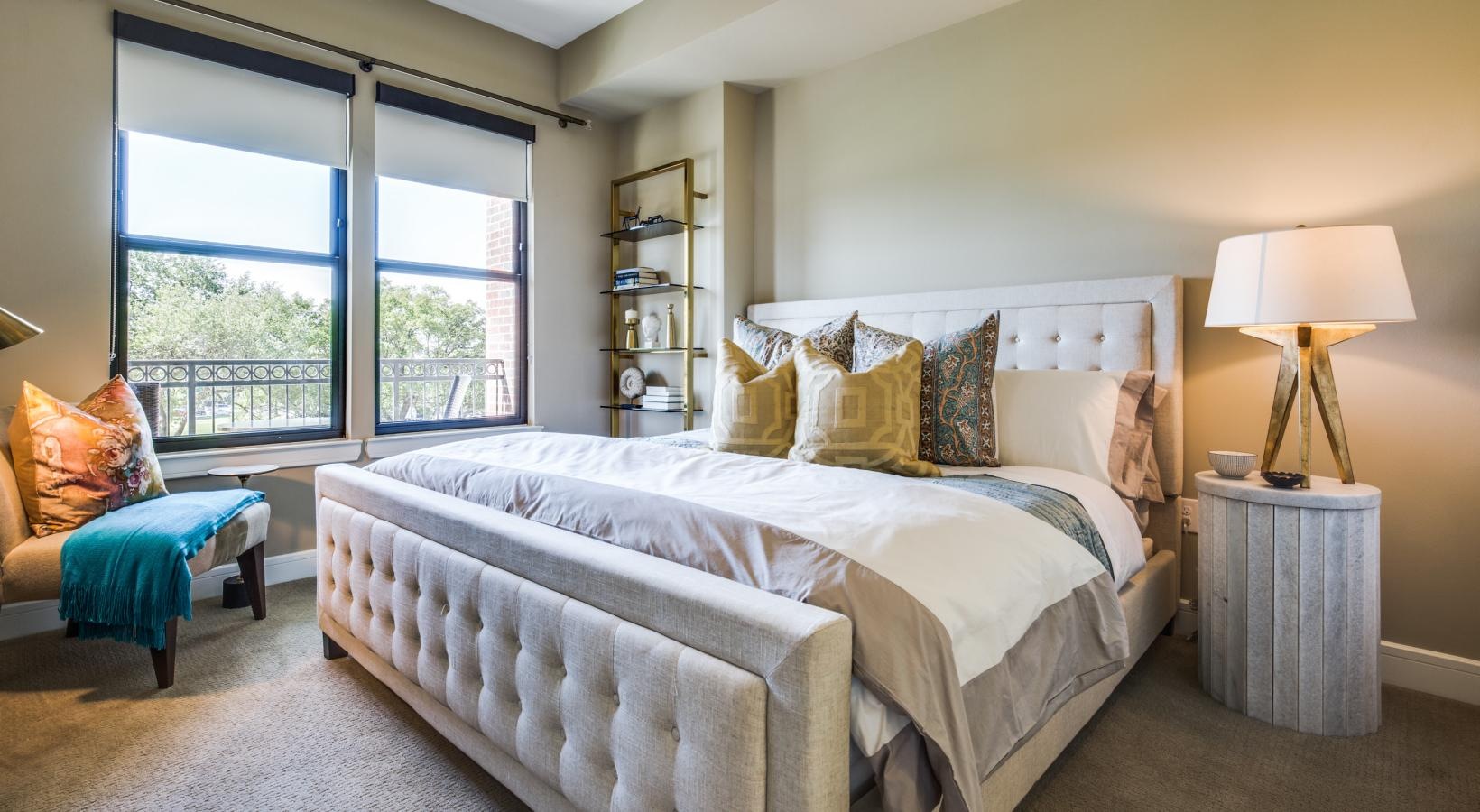 Generous bedroom offerings to fit every family a bedroom with a bed and a chair