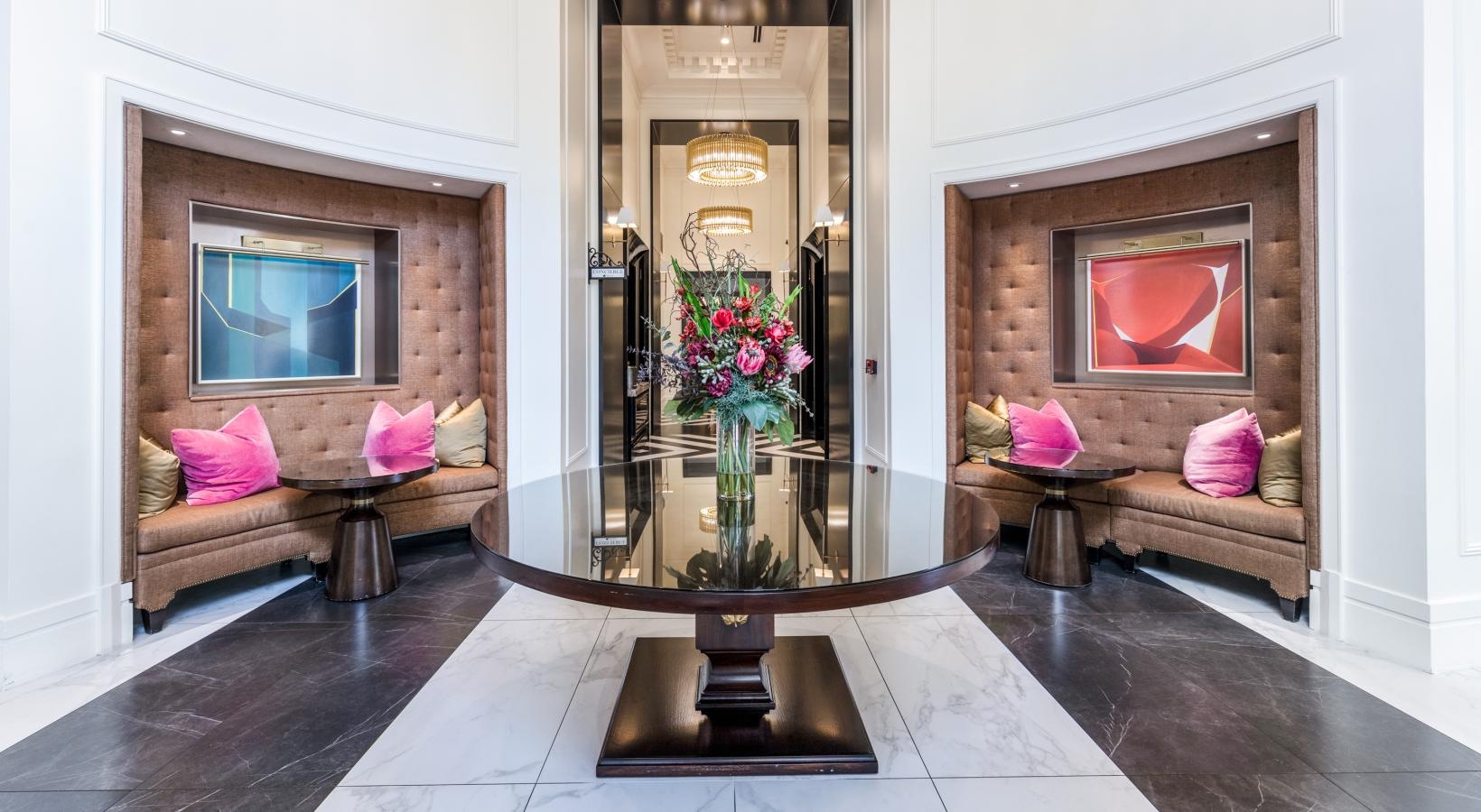 Access to resident-only features a room with a glass door and a vase with flowers