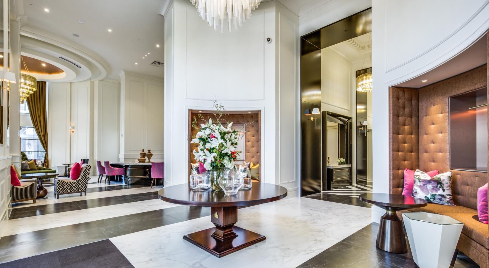 Everything within reach a large room with a black and white tile floor