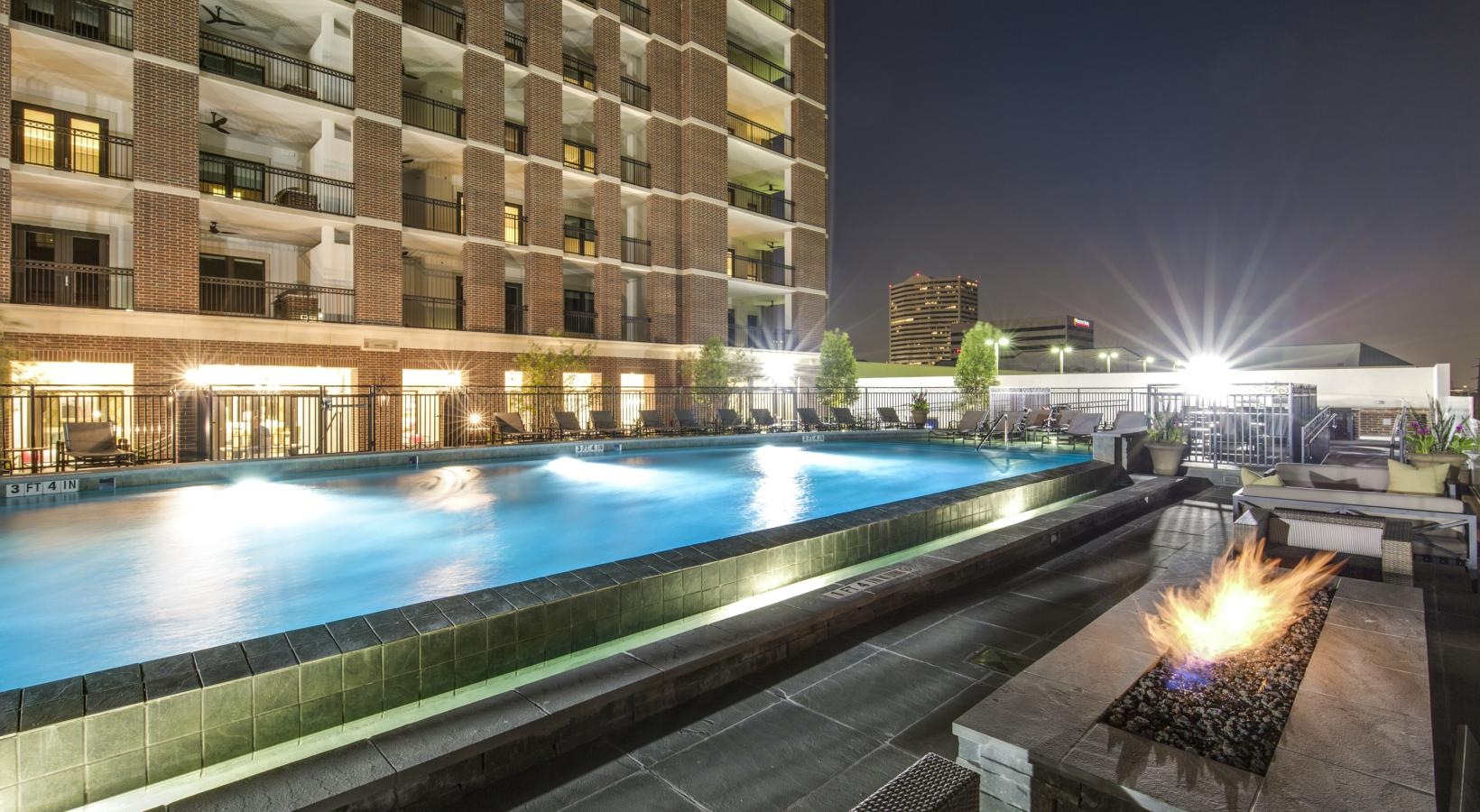 The essence of exceptional living a pool on a building rooftop near a firepit