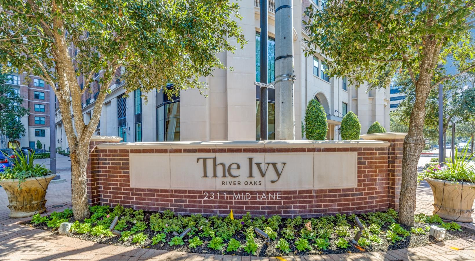 Find your perfect fit at The Ivy a sign on a brick wall