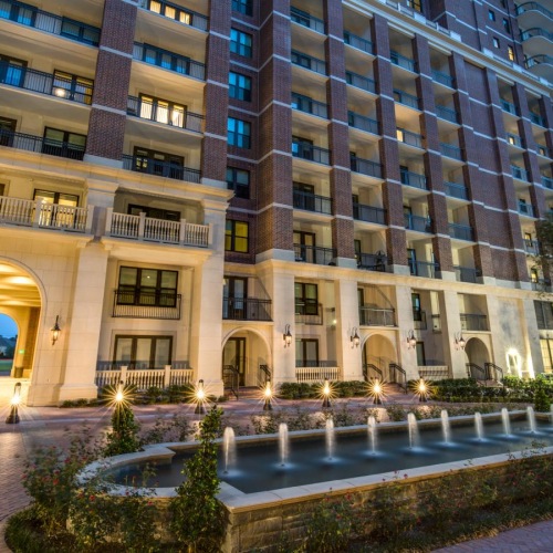 Find your perfect fit at The Ivy a building with a car parked in front  and a fountain