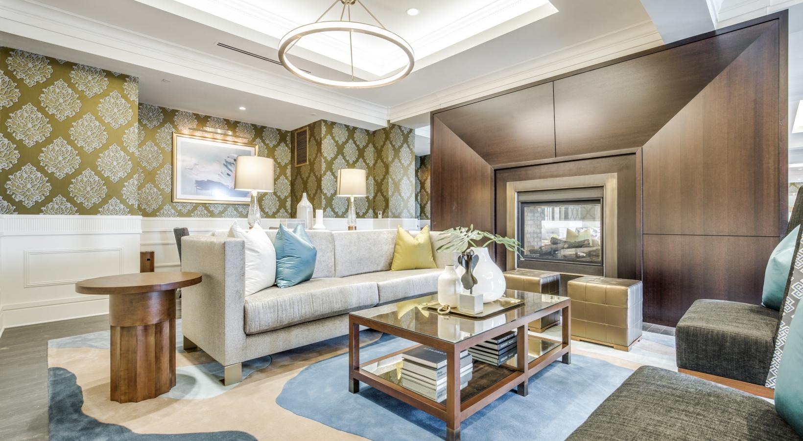 Relax and recharge in beautiful and spacious bedrooms a room with a couch and a table and a fireplace