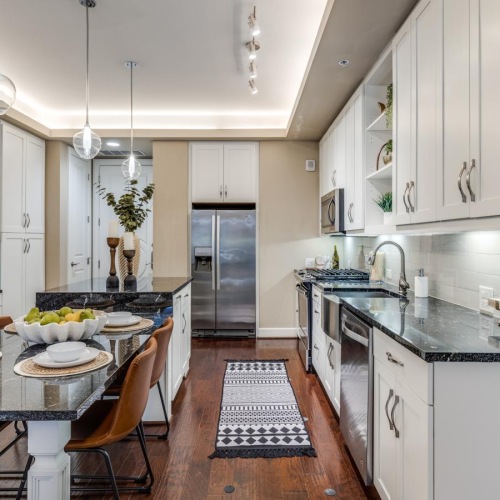 Spacious kitchens with thoughtful details a kitchen with white cabinets