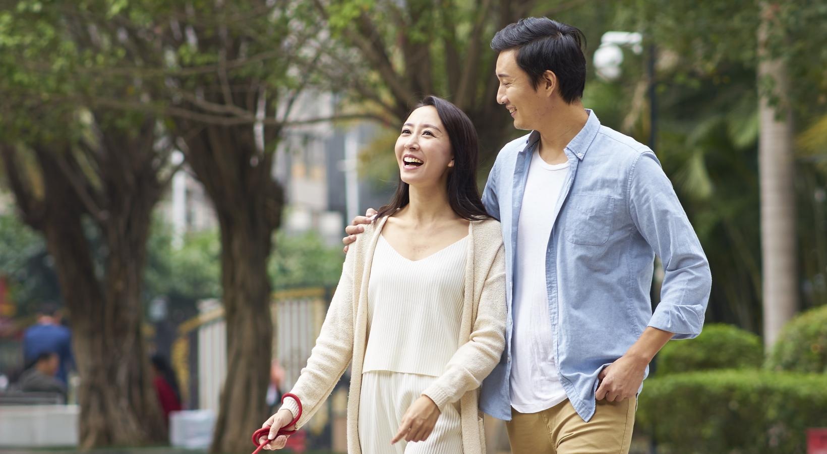 The Ivy is a pet-friendly community! a man and woman walking a dog