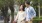 a man and woman walking a dog