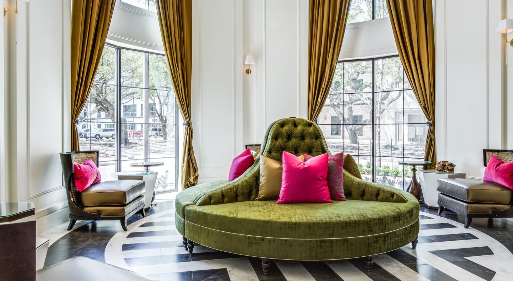 Access to resident-only features a spacious room with a chandelier and a couch