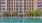 a large building with a pool in front of it